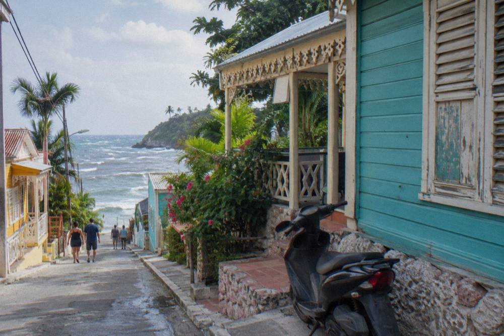Colourful Victorian wooden buildings along a quiet street in the historic centre of Puerto Plata