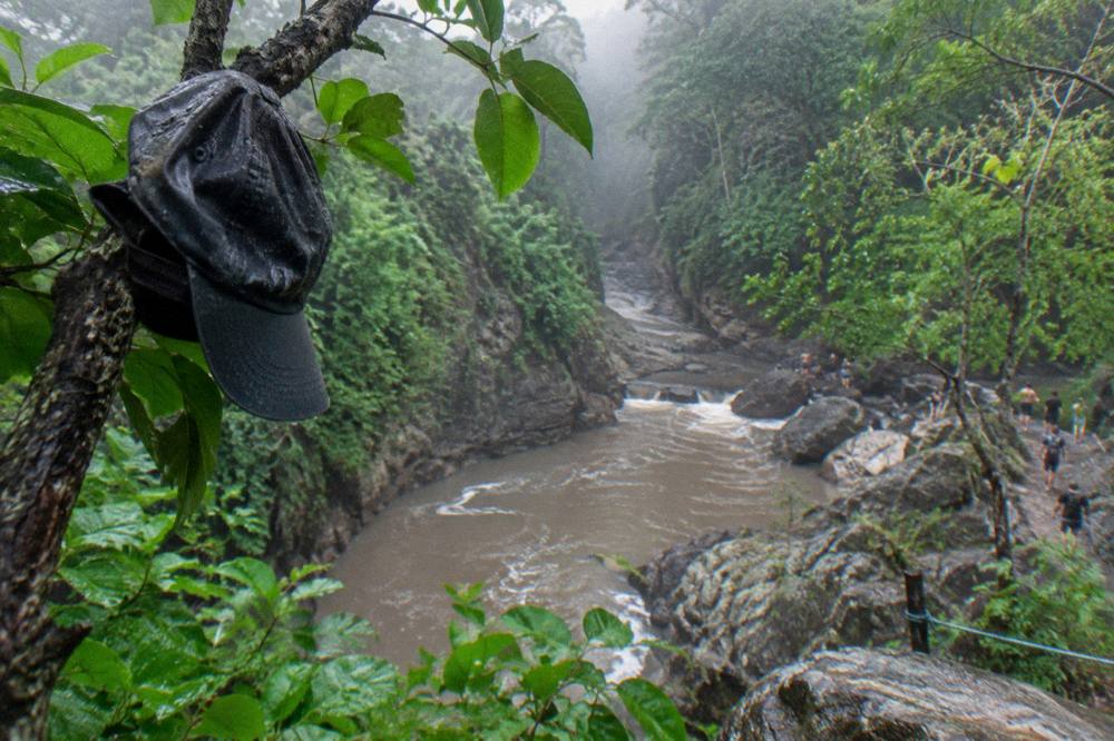 Forest river seen from above with mist rising after rain